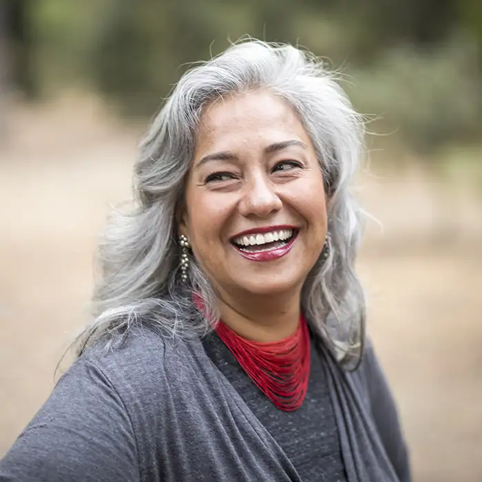mature woman smiling outdoors