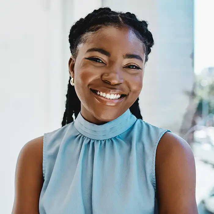 young woman smiling indoors